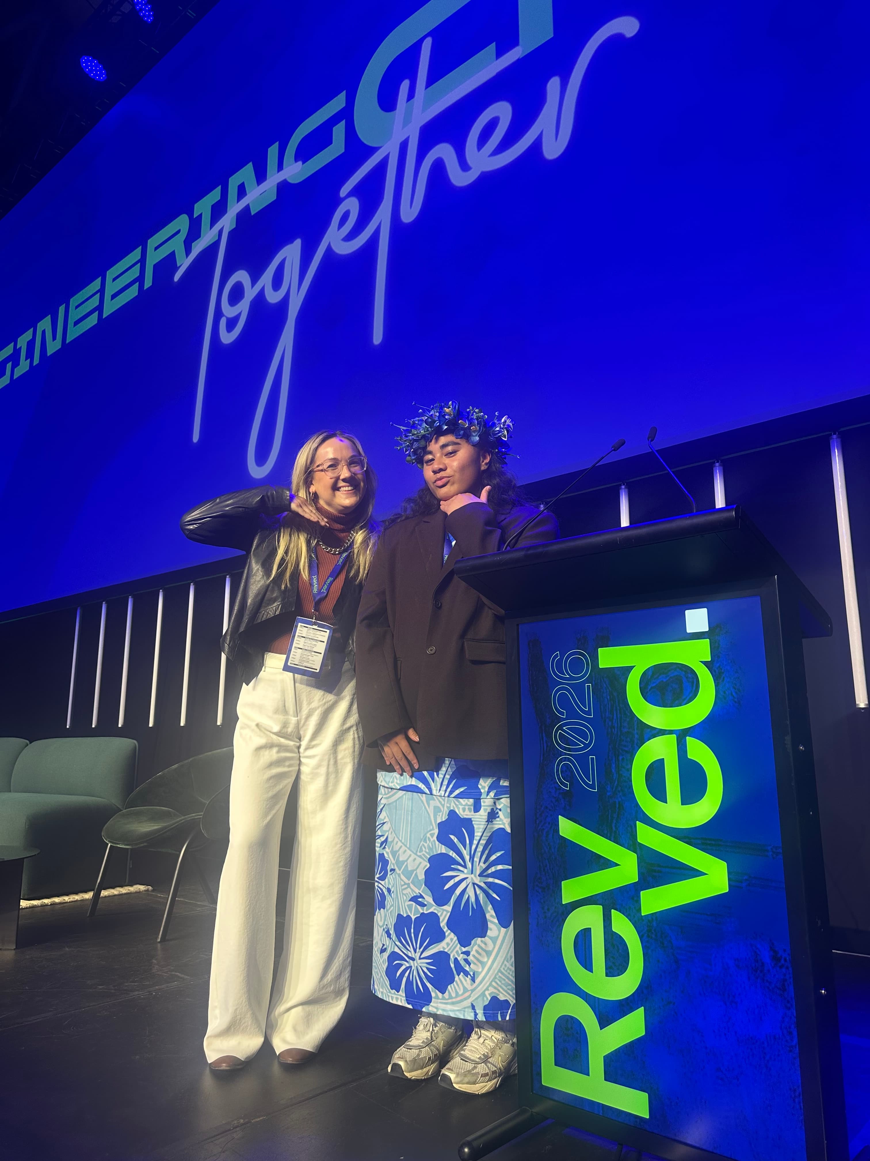 Tash Fernandez and Faith standing together on the REVVED 2026 stage.